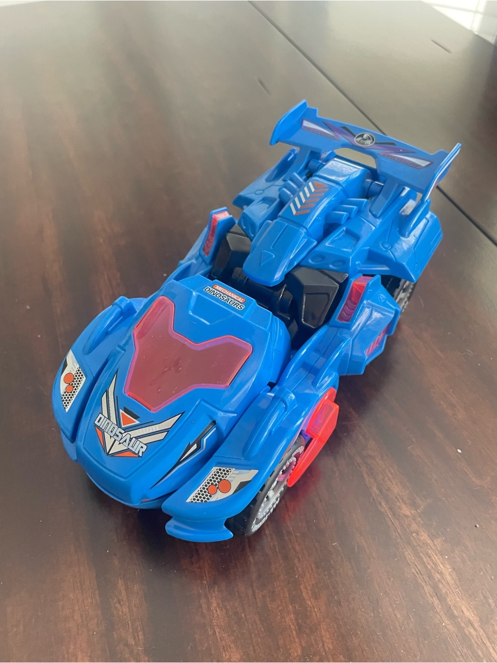 Blue Kids Racing Car Toy with Red Accents - Dinosaur Graphic